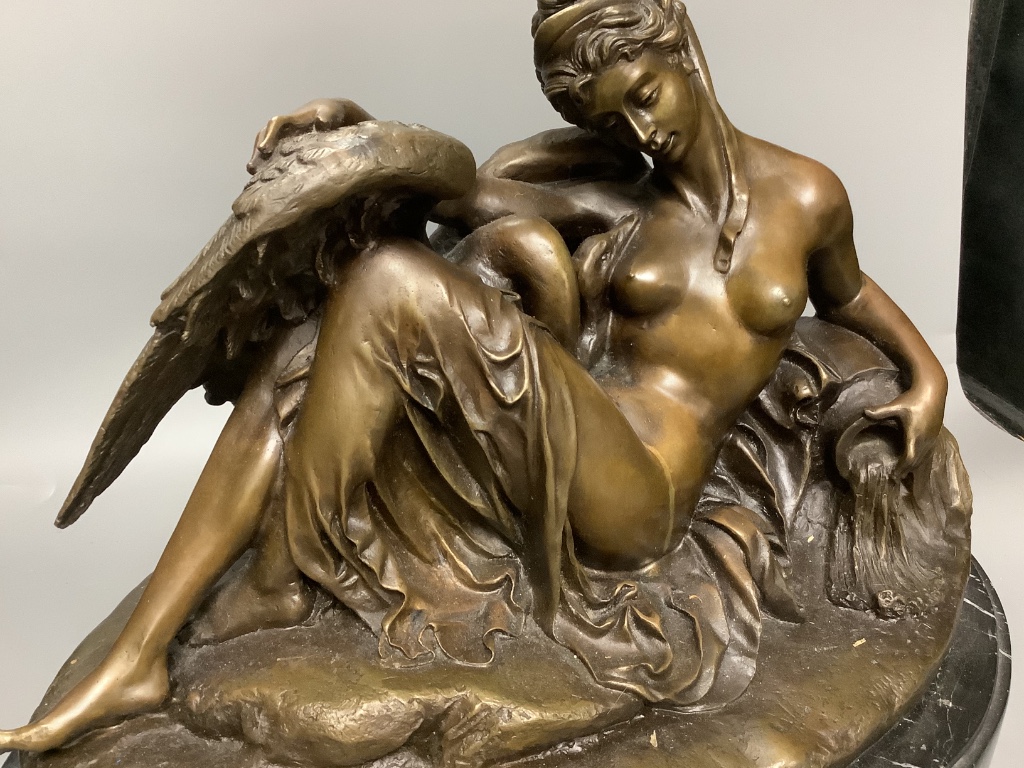 A cold cast resin bronze of Leda and the swan, on marble base, length 48cm